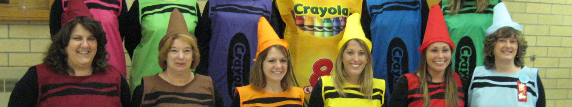 Teachers dressed up in crayon costumes